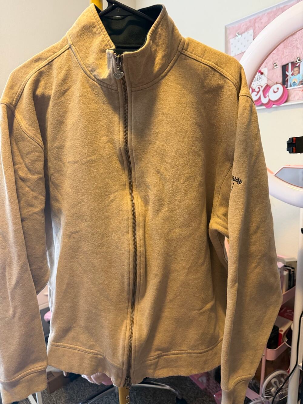 Callaway full-zip fleece jacket tan color and a brand logo on the left sleeve